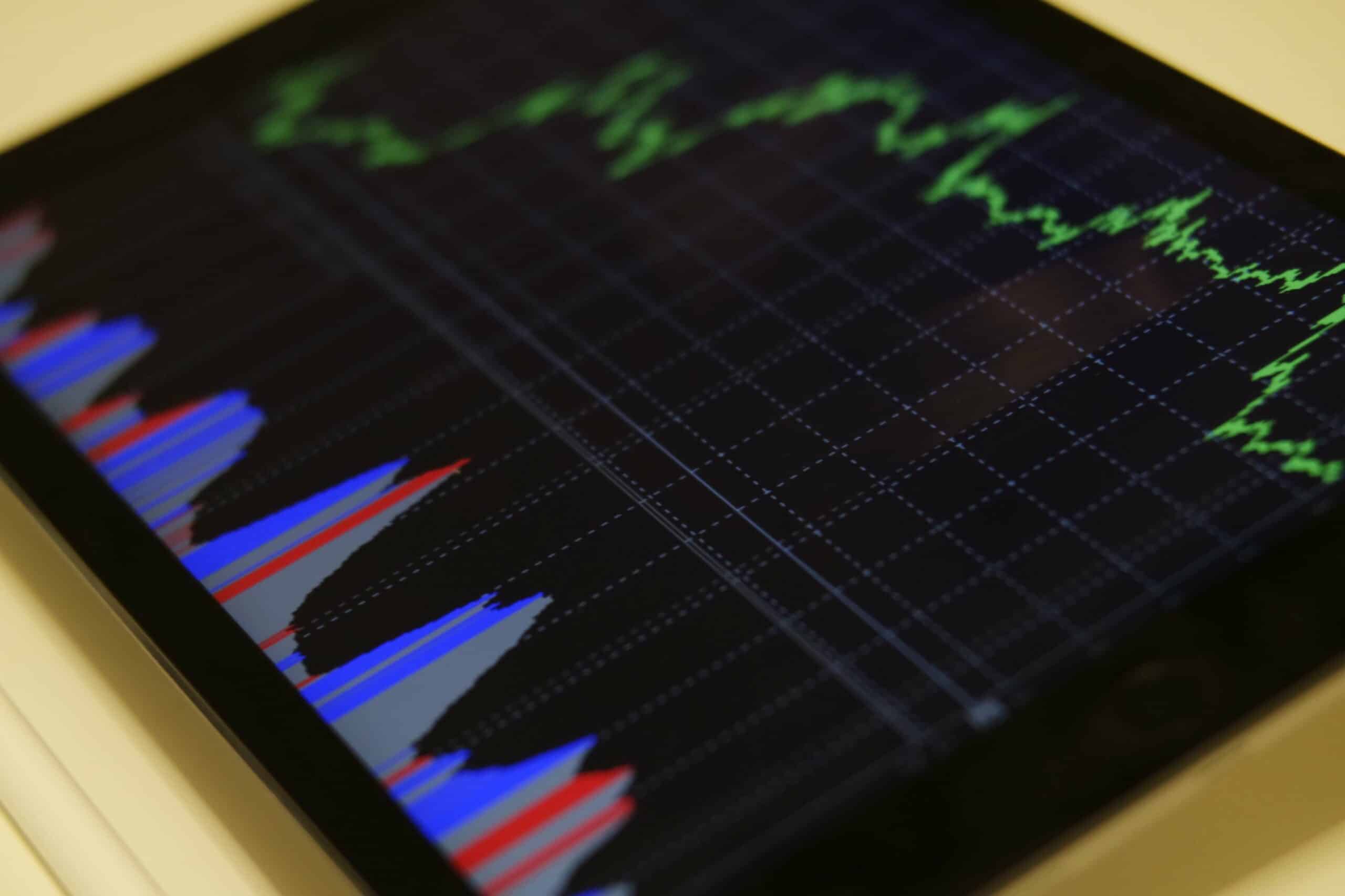 tablet on table showing stock chart