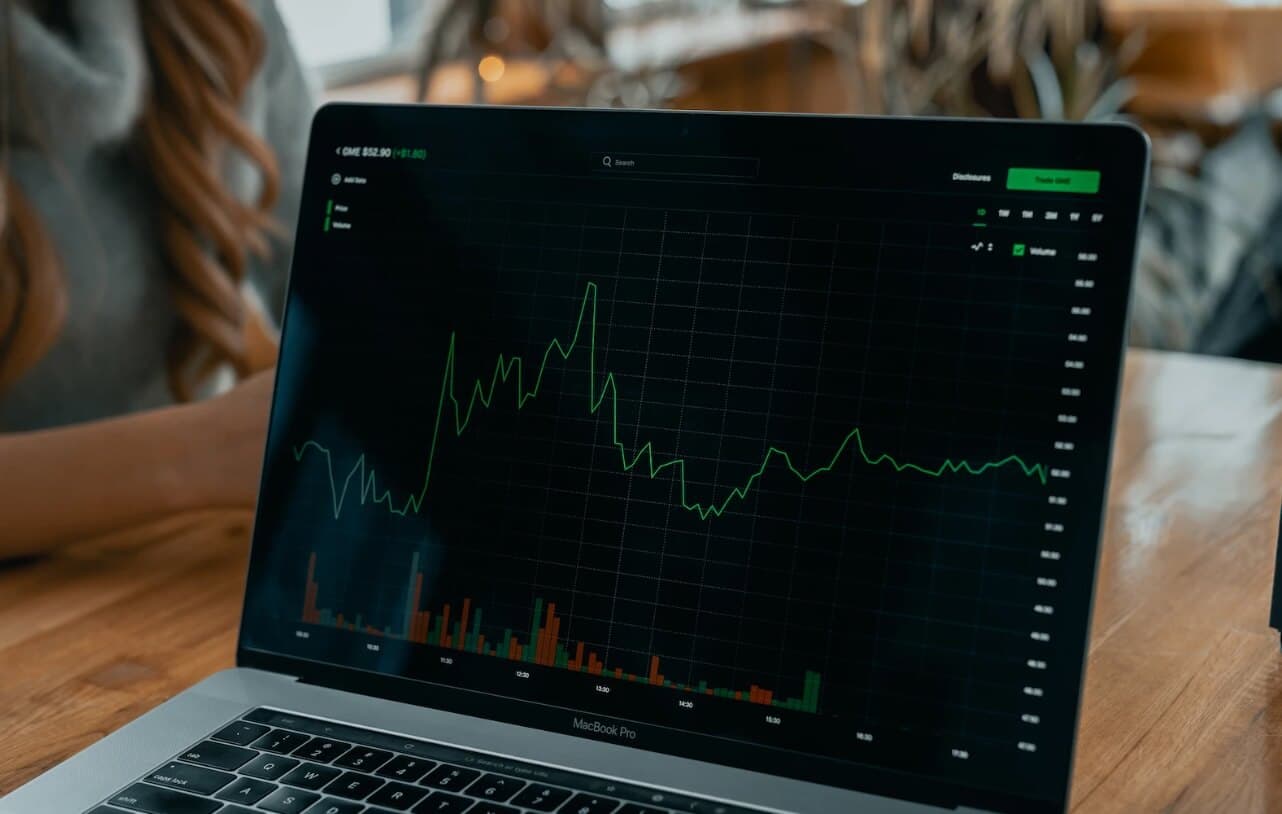 laptop with dark screen showing a trade