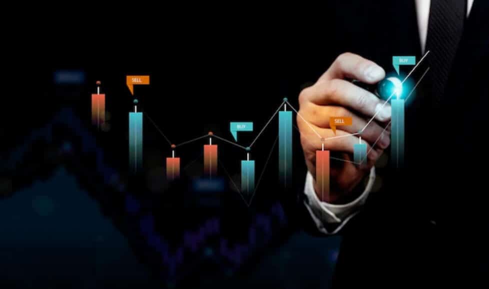 person writing on a virtual trading chart