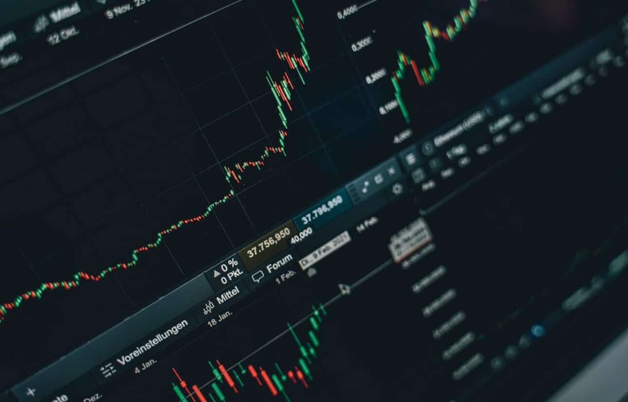 close up of screen showing dark trading chart
