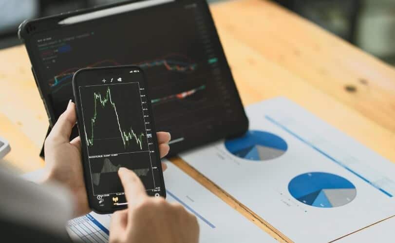 phone and tablet showing forex chart