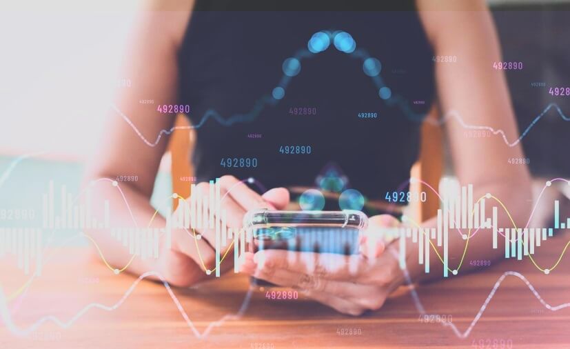 woman with phone showing virtual trading data blue with chart