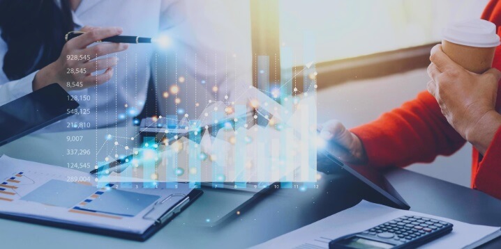 virtual forex chart in front of people working